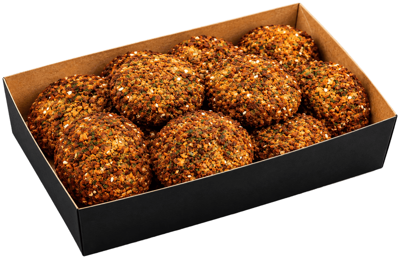 Golden crispy falafel in a black tray