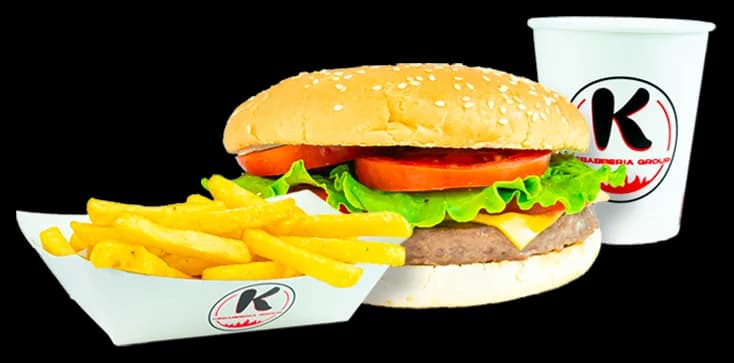 Burger with cheese, tomato and lettuce in a sesame bun, with fries and a K cup