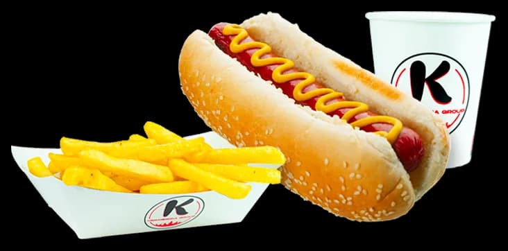 Hot dog with mustard in a sesame bun, with fries and a K cup